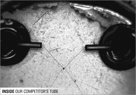 A competitor's gauge tube with inconsistent solder joints on their thermocouples